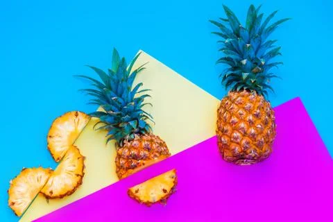 Pineapple fruit on bright colored backgrounds Stock Photos