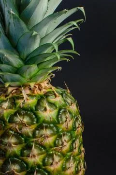 Pineapple fruit close up, black background Stock Photos