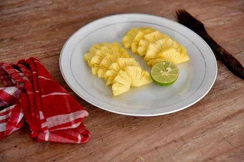 Pineapple fruit dessert,served on the white plate. Stock Photos