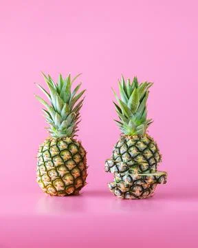 Pineapple fruit isolated on pink background. Stock Photos