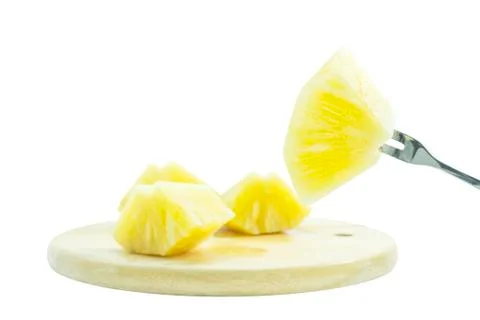 Pineapple fruit slice serve with fork on white plate Stock Photos