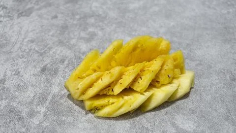 Pineapple fruit slices on gray background with concrete texture Stock Photos