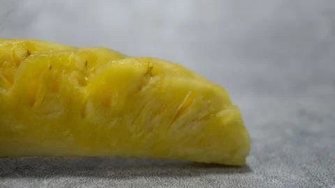 Pineapple fruit slices on gray background with concrete texture Stock Photos