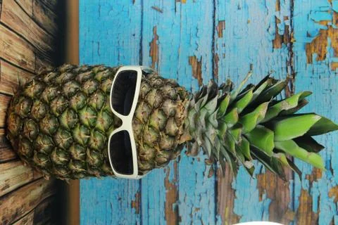 Pineapple fruit with white  sunglasses Stock Photos