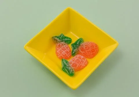 Pineapple gummy candy in candy dish Stock Photos