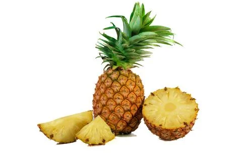 Pineapple with half and slices isolated on a white background Stock Photos