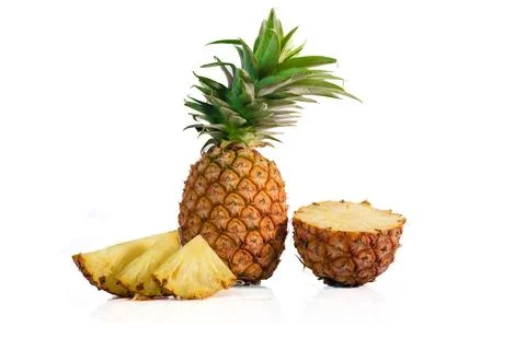 Pineapple with half and slices isolated on a white background Stock Photos