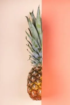 Pineapple half on bright background creative layout, copy space. Flat lay pat Stock Photos