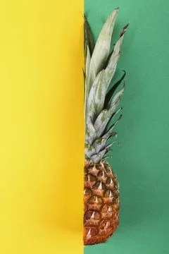 Pineapple half on bright background creative layout, copy space. Flat lay pat Stock Photos