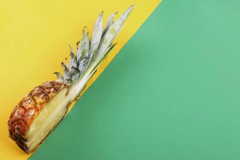 Pineapple half on bright background creative layout, copy space. Flat lay pat Stock Photos