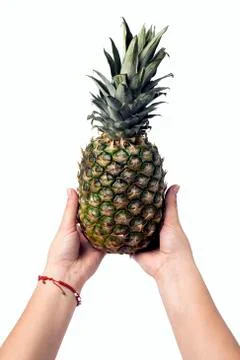 Pineapple in hand Stock Photos