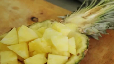 Pineapple for the holiday table, diced on a board. Stock-Footage 142992253