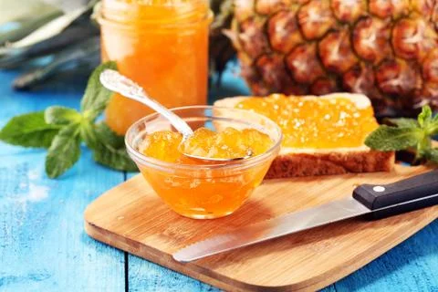 Pineapple jam with fresh pineapple and mint. marmalade on spoon and jar. Stock Photos