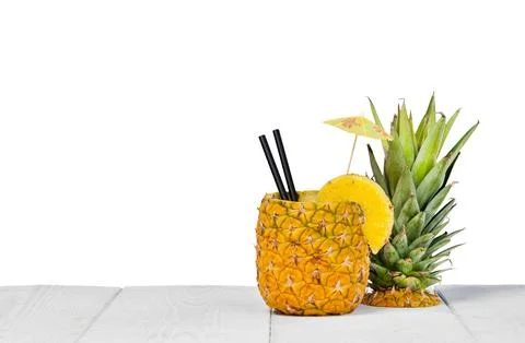 Pineapple juice served in the peel Stock Photos