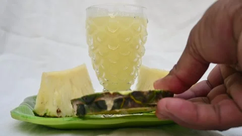 Pineapple juice on white background. Stockbeeldmateriaal 326128437