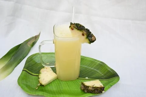 Pineapple juice on white background. Stock Photos