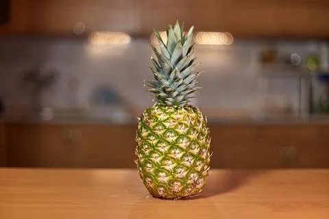 Pineapple on the kitchen counter Stock Photos