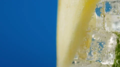 Pineapple lemonade on blue background. Fruit ananas cocktail close-up texture Stock Footage 196936474