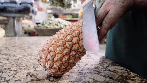 Pineapple with machete 2 Stock Footage 128013865