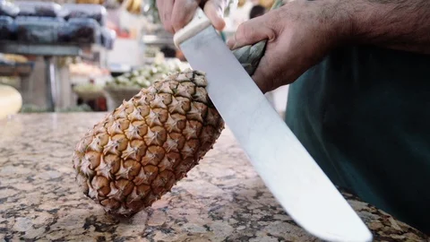 Pineapple with machete 스톡 동영상 128013805