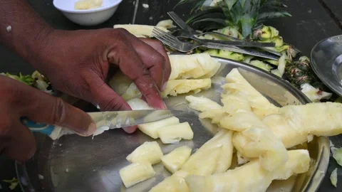 Pineapple or Ananas comosus chopping with knife. Stock Footage 318599879