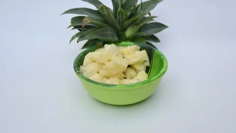Pineapple or Ananas comosus slices on white background. Vidéo 318535528