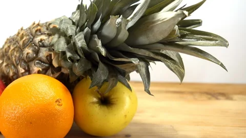 Pineapple, orange and apple close-up Stock-Footage 120514702