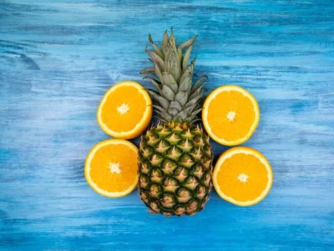 Pineapple with orange halves Stock Photos