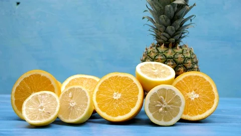 Pineapple, oranges and sliced lemons Stock Footage 93441482