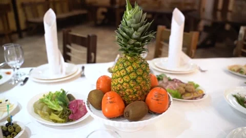 Pineapple with persimmon on the festive table 動画素材 246525694
