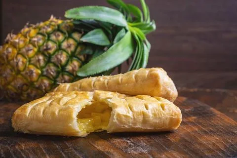 Pineapple Pie and Pineapple Fruit on a Wooden Background 写真素材
