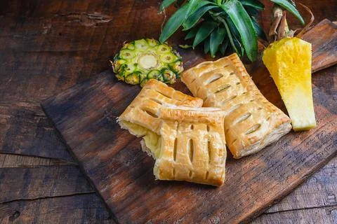 Pineapple Pie and Pineapple Fruit on a Wooden Background 写真素材