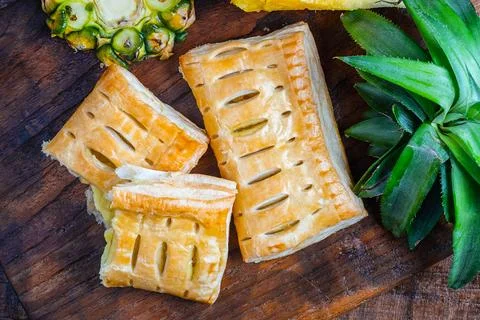 Pineapple Pie and Pineapple Fruit on a Wooden Background 写真素材