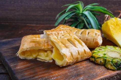 Pineapple Pie and Pineapple Fruit on a Wooden Background 写真素材