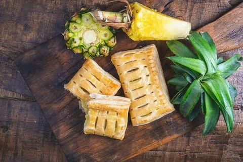 Pineapple Pie and Pineapple Fruit on a Wooden Background 写真素材