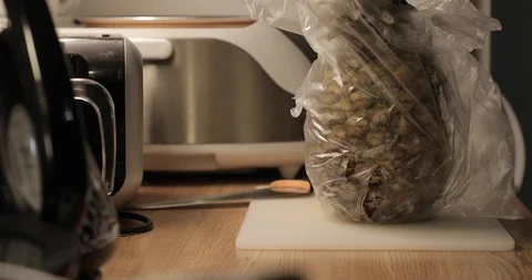 Pineapple removed from the package on the kitchen table Stock Footage 88977433