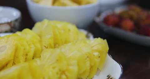 Pineapple rings Closed-up shot of pineapple pieces in light syrup on plate Stock Footage 281648647