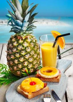 Pineapple rings with melted cheese on ham Stock Photos