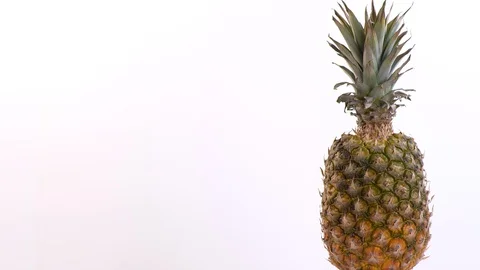 Pineapple Rotating On A White Background Stock Footage 130128783