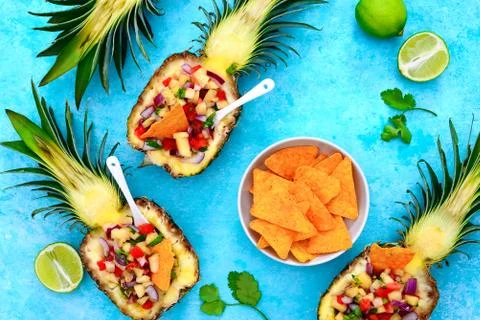 Pineapple salsa served in a pineapple shells Stock Photos