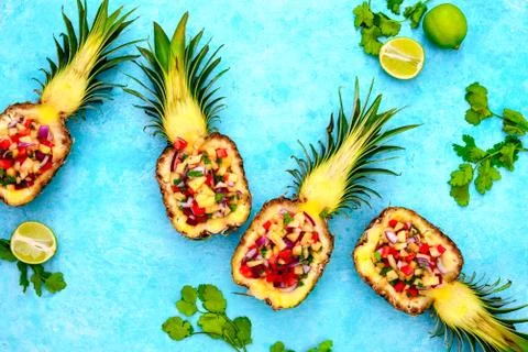 Pineapple salsa served in a pineapple shells Stock Photos