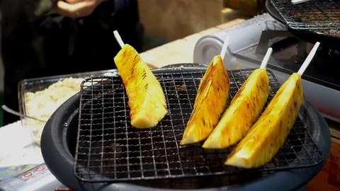 Pineapple skewer grilled was appetizing Stock Footage 84927308