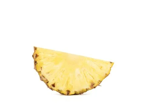 Pineapple slice in the form of a semicircle isolated on a white background. Stock Photos