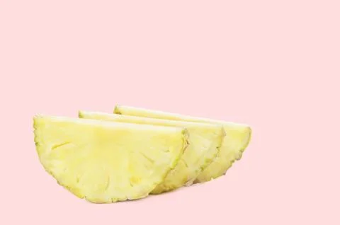 Pineapple slice isolated on a pink background. Stock Photos