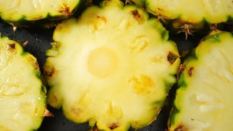 Pineapple Slice in mesmerizing macro video Stock Footage 246594636