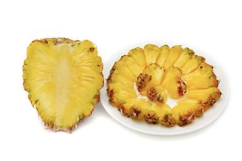 Pineapple slice on a plate isolated on white background Stock Photos