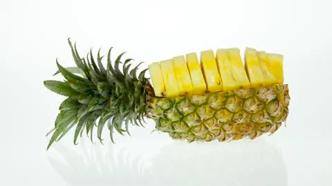 Pineapple with slices isolated on white Stock Photos