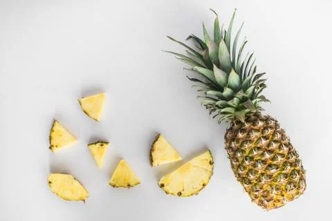 Pineapple slices lay flat on white background Stock Photos
