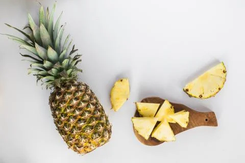 Pineapple slices lay flat on white background Stock Photos
