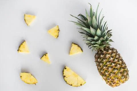 Pineapple slices lay flat on white background Stock Photos
